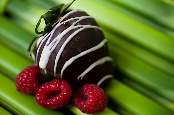 Chocolate covered strawberry with raspberries